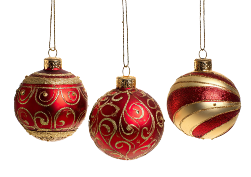 Three red and gold Christmas ornaments hanging