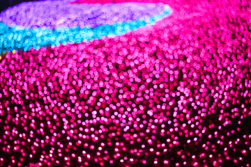 Colored decorative festive bokeh lights sparkle brightly.