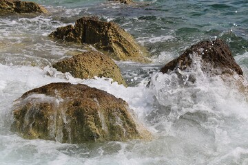 Rocks on a Poreč beach on a windy day
