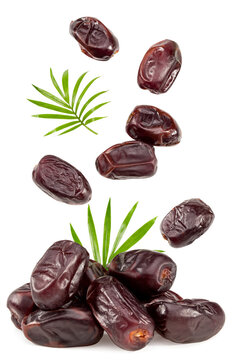 date fruits with green leaves isolated on white background. clipping path