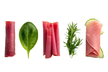 Assorted rolled deli meats and fresh herbs on a white isolated background.