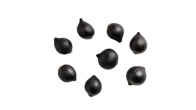 Black garlic cloves isolated on a white background, showcasing their unique shape and texture.