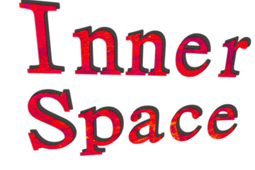 Inscription Inner Space on dark red leaves background