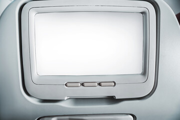 Modern airplane seat with blank screen on the back for entertainment purposes, offering a...