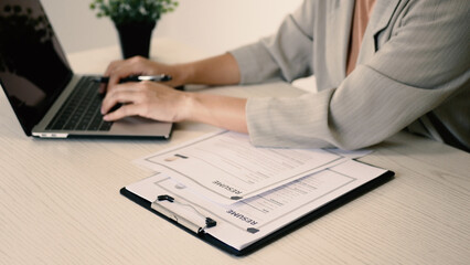 Fototapeta premium Businesswoman employer holding resume, recruiting, planning, evaluating and reviewing resume of job applicant, recruiting new employees, recruitment concept