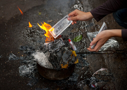 Burning a note as an offering on tet day hanoi, Vietnam