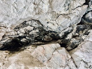 Deep Black Crevice in a White Rock Formation