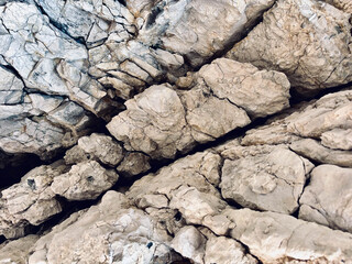 Diagonal Cracks and Textures on a Natural Rock Wall