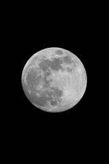 Isolated full moon radiates against a pitch-black Hawaiian sky—capturing the quiet power and raw elegance of lunar light in tropical solitude.