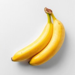 Two ripe bananas on a white surface