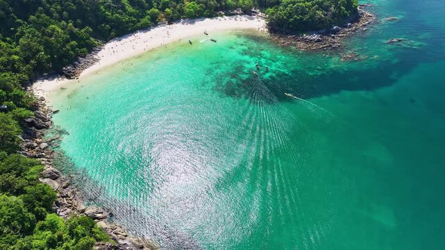 Aerial view Drone camera of seashore rocks in summer season, Beautiful sea surface, Amazing sea waves crashing on rocks seascape in Phuket island Thailand, Aerial view drone 4k High quality footage