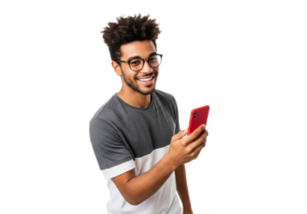 Young, smiling multiethnic man with curly hair and modern glasses, wearing grey t-shirt over white undershirt, holding vibrant red smartphone in bright, evenly lit professional studio with transparent