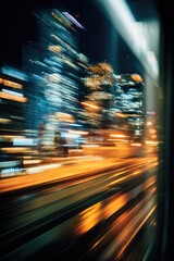 Blurry night cityscape viewed from a moving vehicle