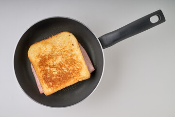 Crusty croque-monsieur on pan