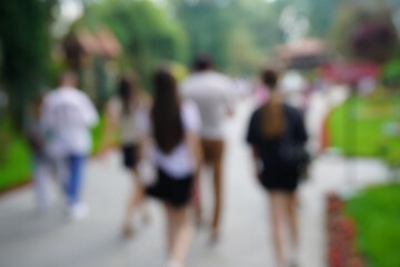 Blurred background. A beautiful park with people. The background image.