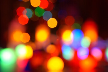 New Year's illumination and glowing Christmas toys. Blurred bright background. Bokeh.