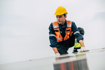 Construction worker inspects roof structure at a high elevation on a cloudy day