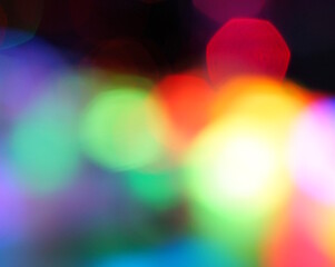 Blurred Christmas background. Glowing garlands and toys.