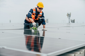 Solar panel installation on a rooftop by a technician wearing safety gear during overcast weather