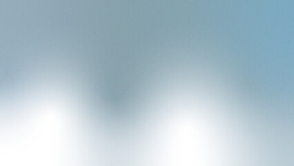 Silver grey to powder blue metallic gradient abstract background. Smooth ombre blend with soft center light glow, subtle shimmer, noise‑grain texture blur. Cool futuristic elegance for design use