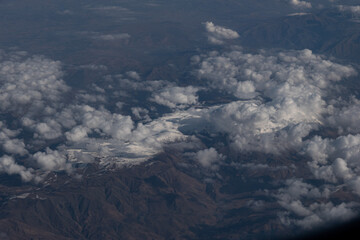 Fototapeta premium Clouds Rolling Over Mountainous Terrain