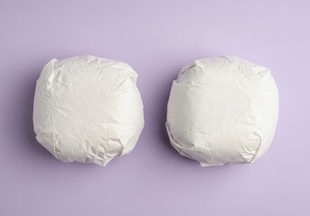 Wrapped buns on a purple background a food mockup for packaging design