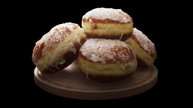 Looping animation around a composition of European classic donuts lying on a wooden board. Loop motion. Alpha Channel. Close-up.