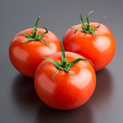 Three vibrant tomatoes