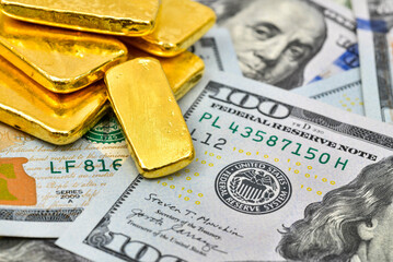 Paper us 100 dollar bill with gold bars, concept of investment and saving, wealth	