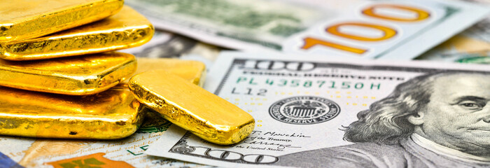 Paper us 100 dollar bill with gold bars, concept of investment and saving, wealth	