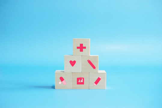 Healthcare medical icon wood block on blue background,Copy and space,Health medical Insurance concept