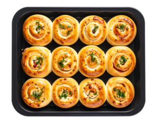 A baking sheet of twelve golden-brown, spiral-shaped pastries, garnished with fresh herbs.