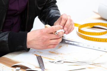 A person is skillfully cutting a piece of paper using scissors