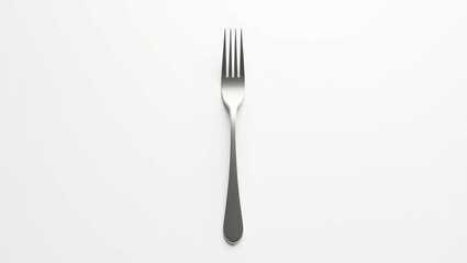 Stainless steel fork on a white background.