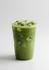 A layered iced matcha latte in a clear plastic cup with a rounded base. The image is isolated on a white background.
