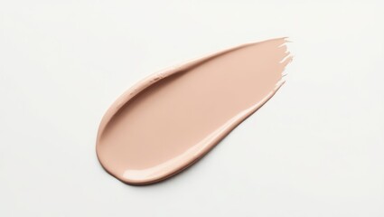 Light peach-toned beauty product smear on white background.