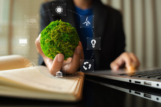 Business man using computer on CO2 emission reduction concept with global warming icon. along with climate, energy, sustainability, environment.