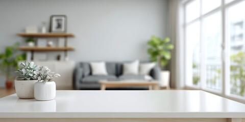 Fototapeta premium Blurred living room view from a white table with potted plants