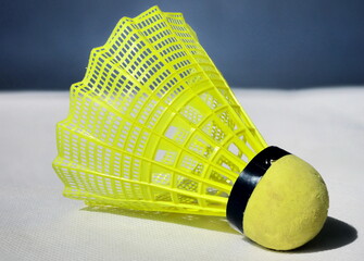 Yellow badminton ball on background

