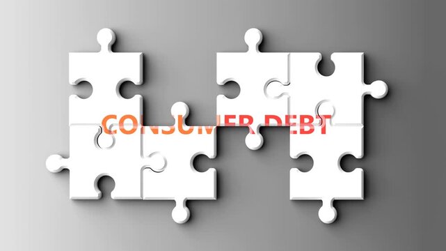 Consumer Debt as a complex topic - pictured as word consumer debt on a puzzle pieces to show that consumer debt is a composite subject. Solving a puzzle. Pieces coming together to make a whole