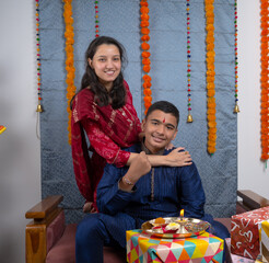 Loving brother and sister with gift box celebrating traditional Indian festival like Rakshabandhan...