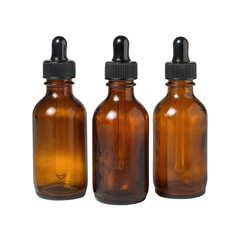 Three brown glass bottles with unique shapes and textures displayed on a neutral surface capturing the essence of natural materials in a minimalist aesthetic.
