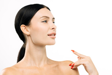 Clear-skinned woman with long black hair poses gracefully, showcasing flawless complexion and...