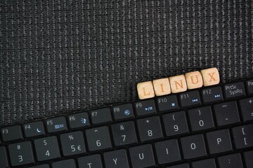 letters of the alphabet with the word linux with dark background. Internet concept. Linux is a...