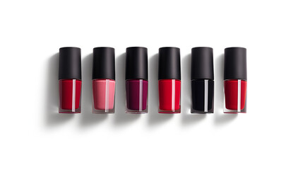 Obraz premium A row of six nail polish bottles in various shades of red and pink with black caps on a white surface .