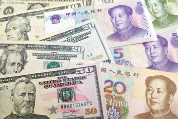 Stack of US Dollar and Chinese Renminbi