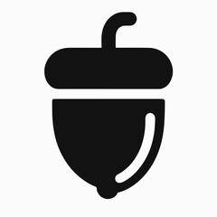 Acorn silhouette icon design with smooth curves and clean lines. Acorn structure captures nature's essence and showcases its organic shape with gloss highlights.