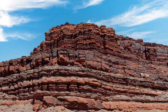 Low angle view of canyon wall with geoligical historic sedimentary rock layer formation in Shafer Canyon Canyonlands National Park near Moab, Utah, USA, reflecting ancient environments