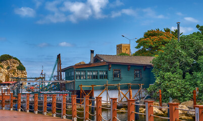 Hotels, cafes and restaurants with a view of the fortress on the Black Sea embankment in Sile