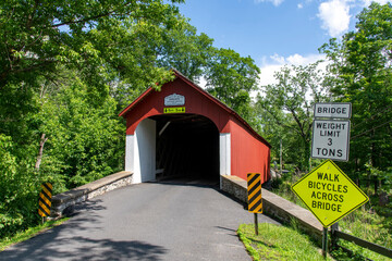 Historic Knecht's Covered bridge in Springfield Township, Bucks County crossing Cooks Creek on Knecht Bridge Road south of Springtown, PA, USA